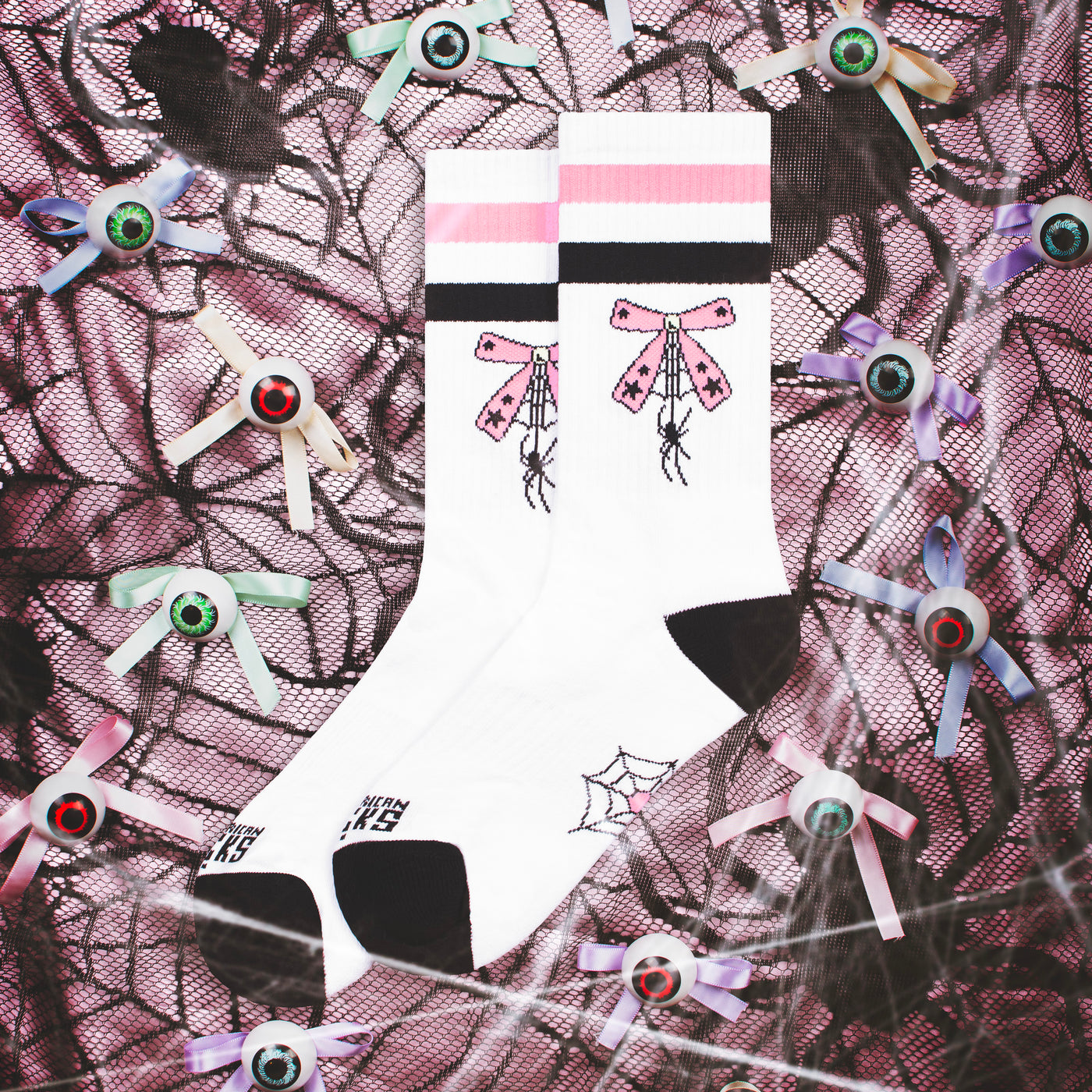 Cute crew socks withlittle spider hanging by a sweet pink ribbon by american socks 