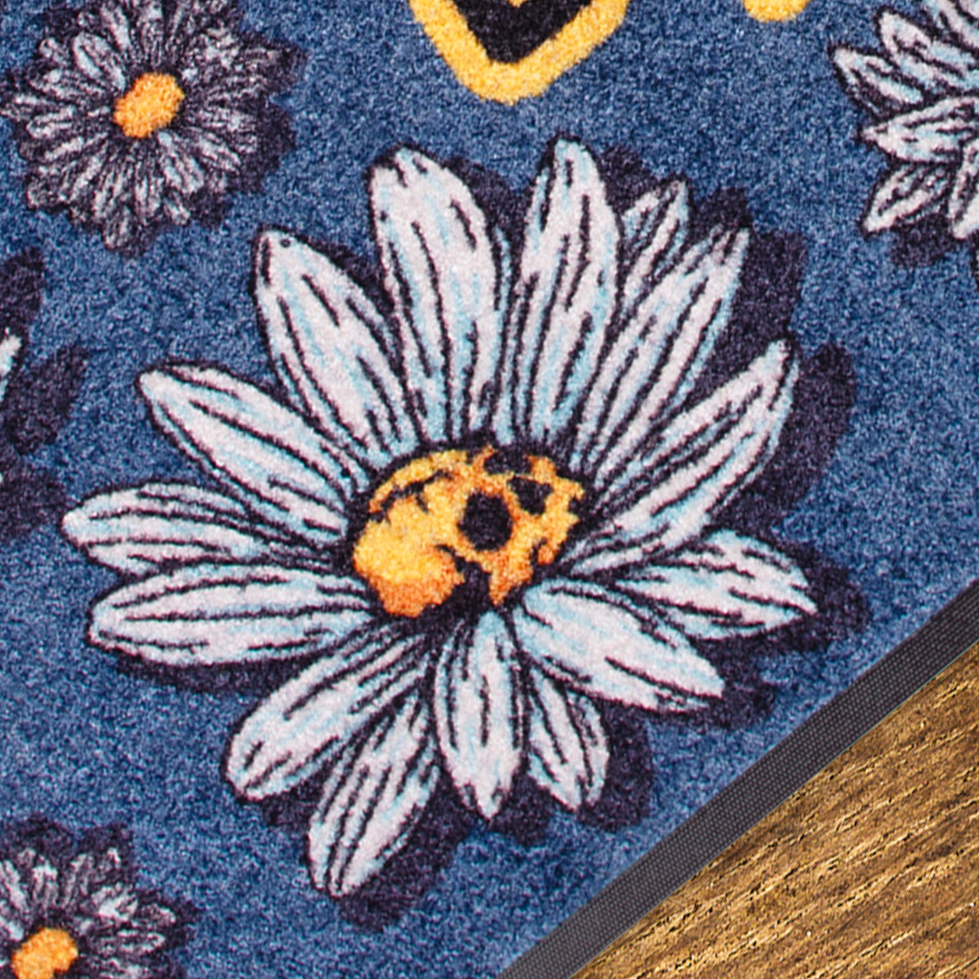 Close up of floral patterned rug with rock daisy flowers with skull in the middle design american socks 