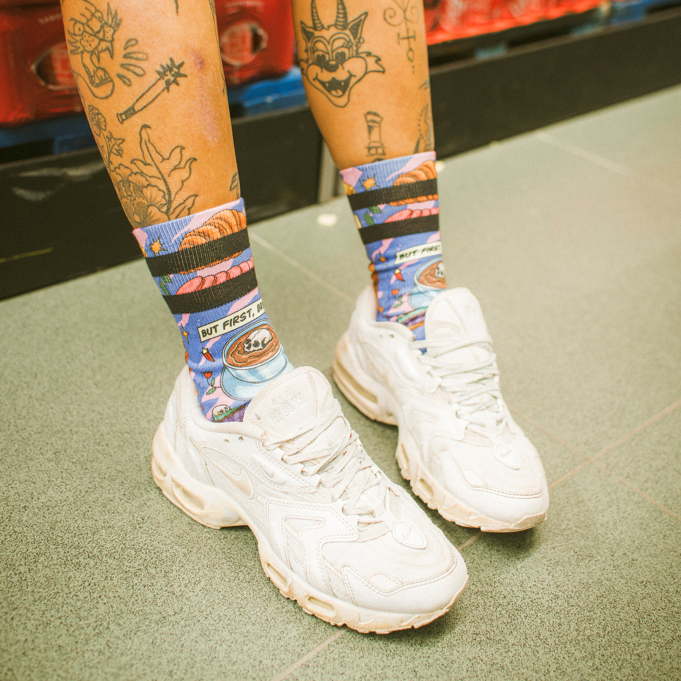 Cute but edgy patterned socks showing death brunch with coffee croissant and food illustrations american socks