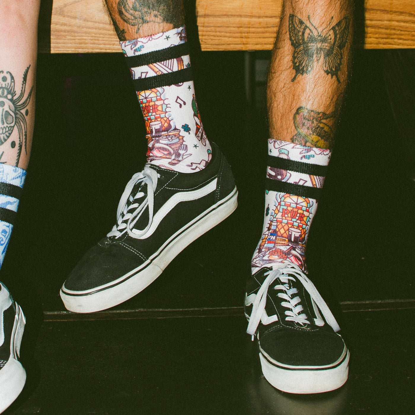 Close up of man wearing fun pub design socks american socks